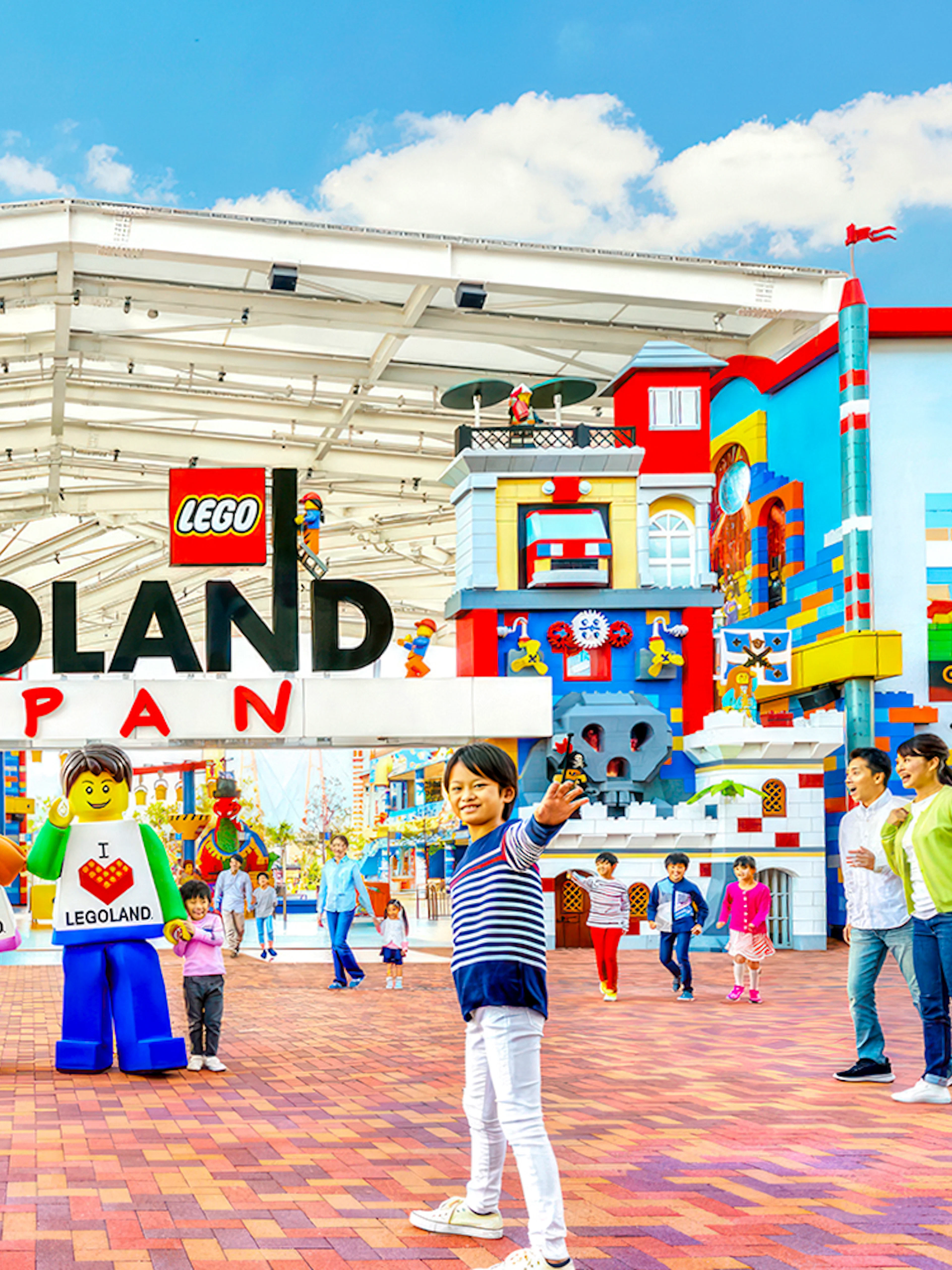Legoland Japan entrance with families and Lego figures.
