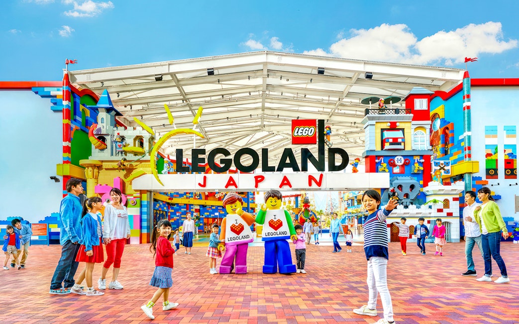 Legoland Japan entrance with families and Lego figures.