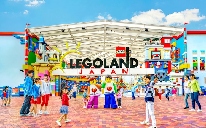 Legoland Japan entrance with families and Lego figures.