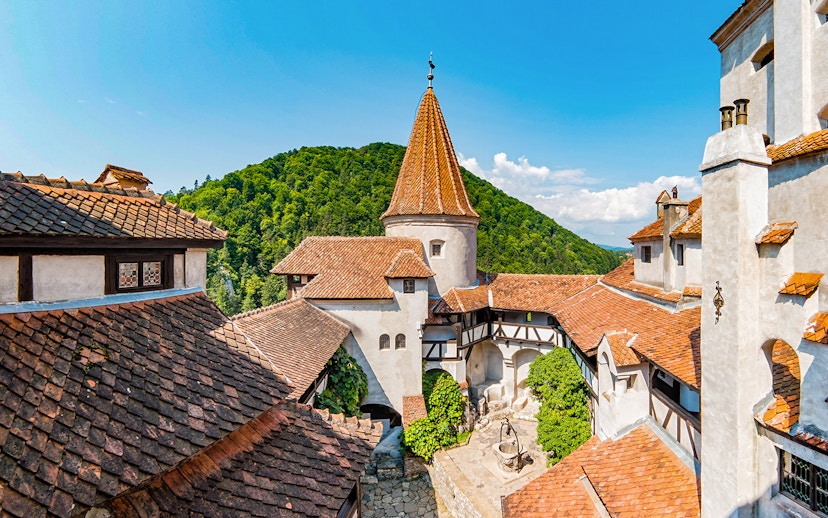 Bran Castle courtyard with view of Donjon tower and surrounding hills.