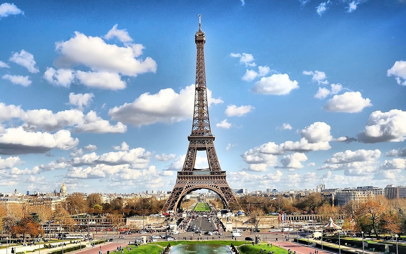 Eiffel Tower in Paris on a sunny day, viewed from Trocadéro Gardens.