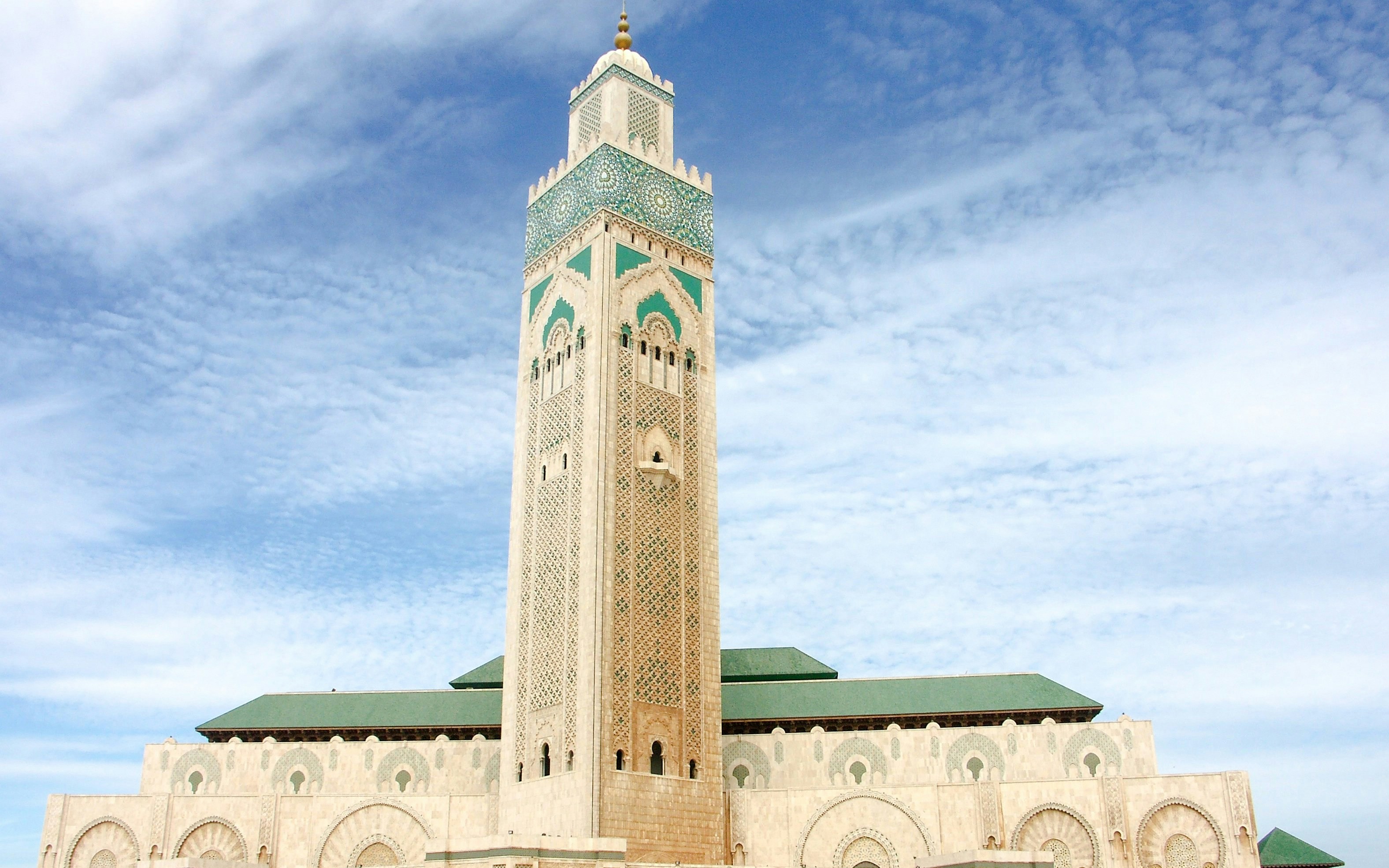 Hassan II Mosque minaret against blue sky in Casablanca, Morocco.