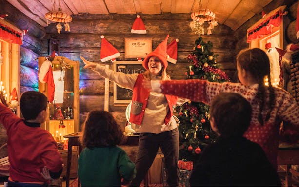 Children participating in a workshop at Elf Hat Academy in Santa's Village.