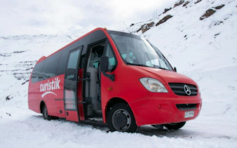 Tourist bus at snowy Valle Nevado, Chile.
