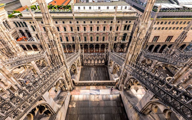 Milan Duomo rooftop view with intricate spires and cityscape, Skip-The-Line tour.