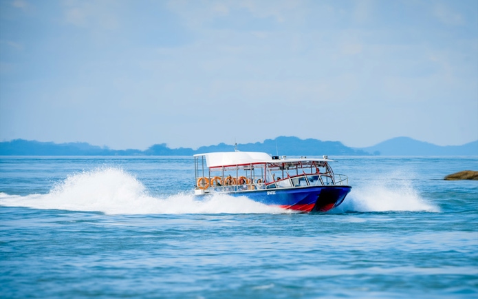Speedboat tour on open water, part of Combo Mega Adventure in Singapore.