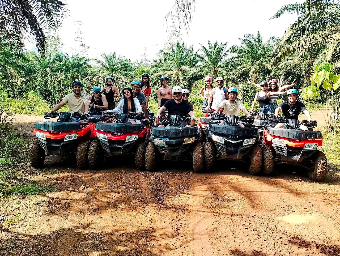 Group on ATVs in tropical Krabi forest during ATV Adventure & BB Gun Shooting Experience.