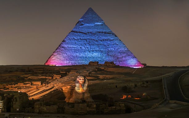 Great Pyramids of Giza illuminated during Sound and Light show, Egypt.