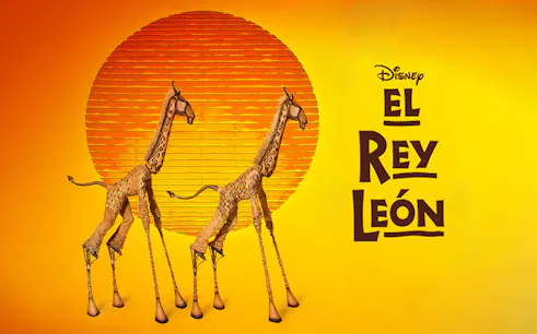 Giraffe puppets from The Lion King musical in front of a stylized sun.