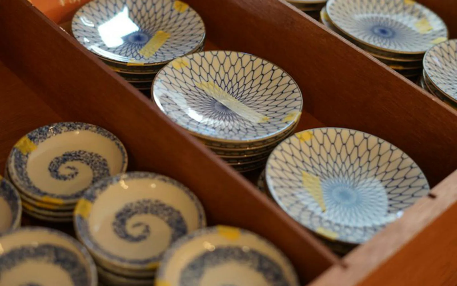 Ceramic plates with kintsugi gold repairs in Asakusa, Tokyo.