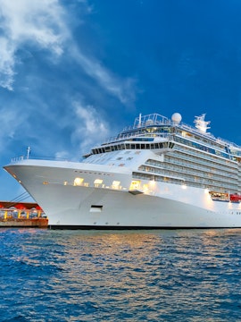 Royal Caribbean cruise ship docked in Singapore harbor.