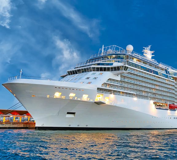 Royal Caribbean cruise ship docked in Singapore harbor.