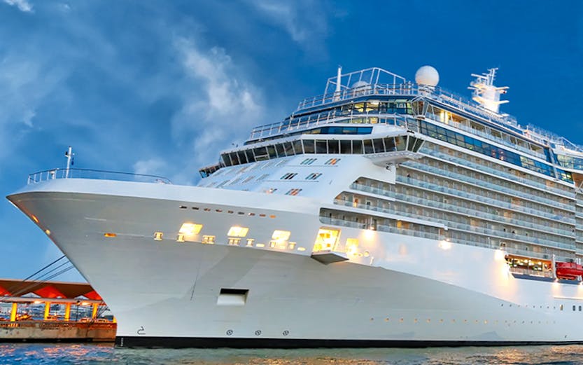 Royal Caribbean cruise ship docked in Singapore harbor.