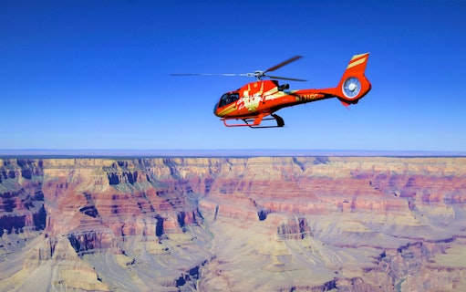 Helicopter flying over the Grand Canyon during Grand Kingdom Hummer Tour.
