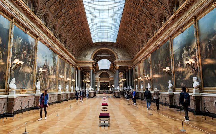 VIP tour group in the Hall of Battles, Palace of Versailles, Paris.