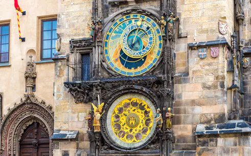 Astronomical Clock in Prague with intricate zodiac and time dials.