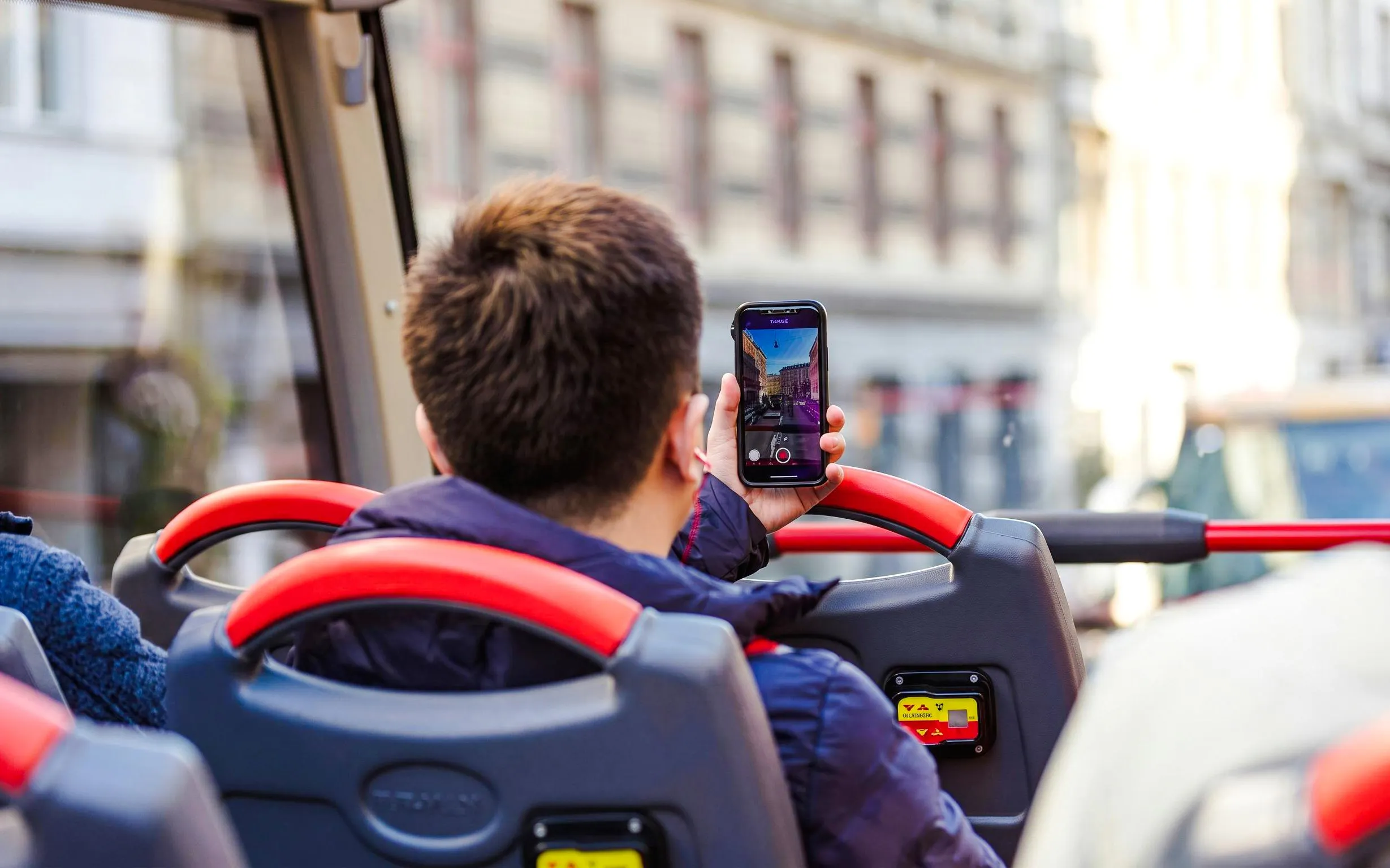 Guests taking photos on Copenhagen hop-on hop-off bus tour.