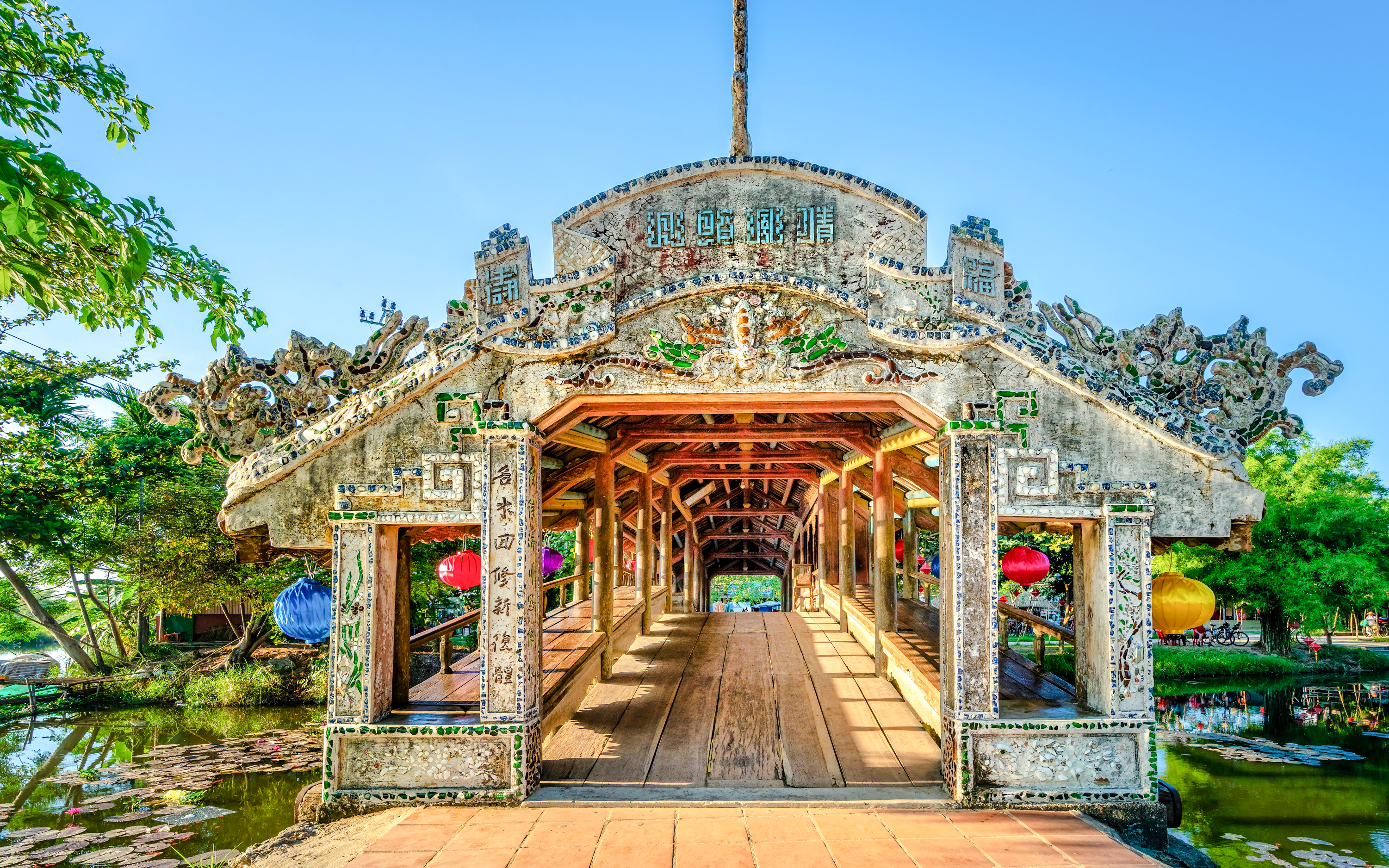 Thanh Toan tile bridge with intricate carvings near Imperial City, Hue, Vietnam.