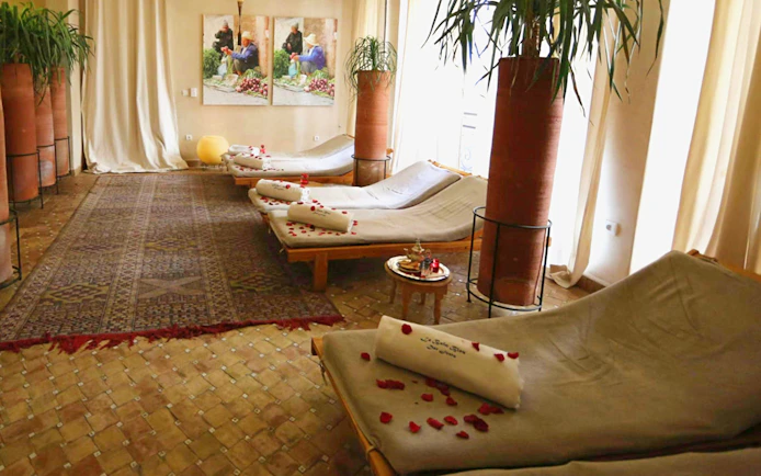 Loungers with rose petals at Le Bain Bleu Hammam & Spa, Marrakesh.