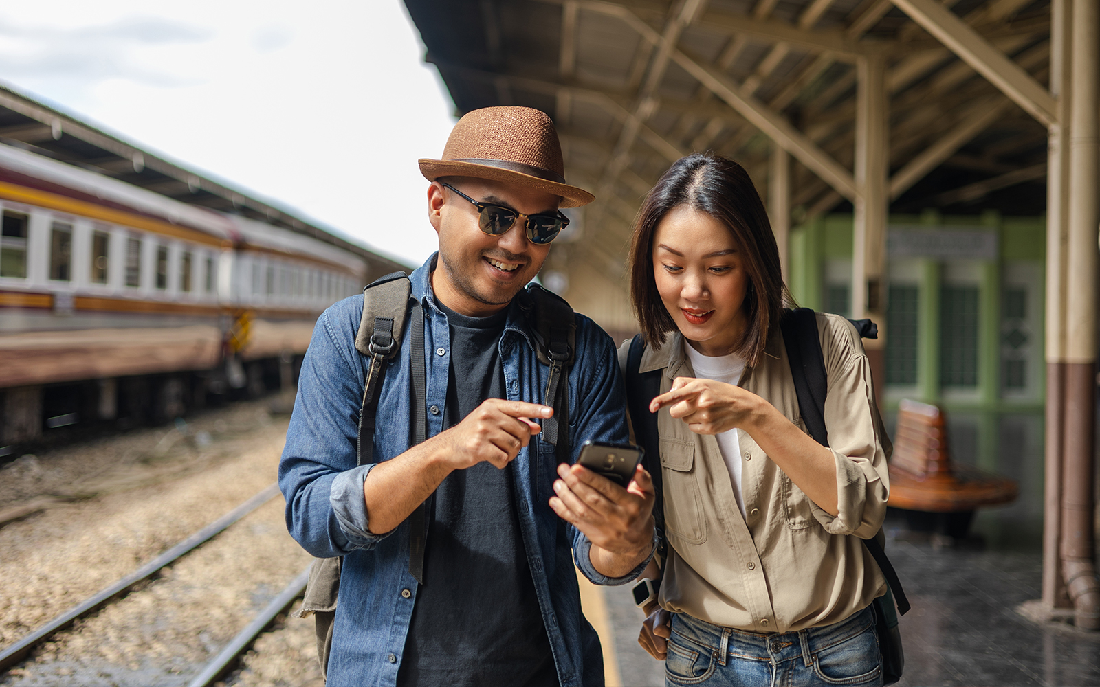 Asian couple in Naples planning their visit to Catacombs of naples.