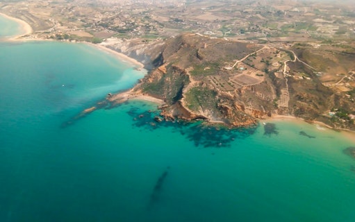 Aerial view of Scala Dei Turchi cliffs and turquoise sea, Agrigento, Sicily.