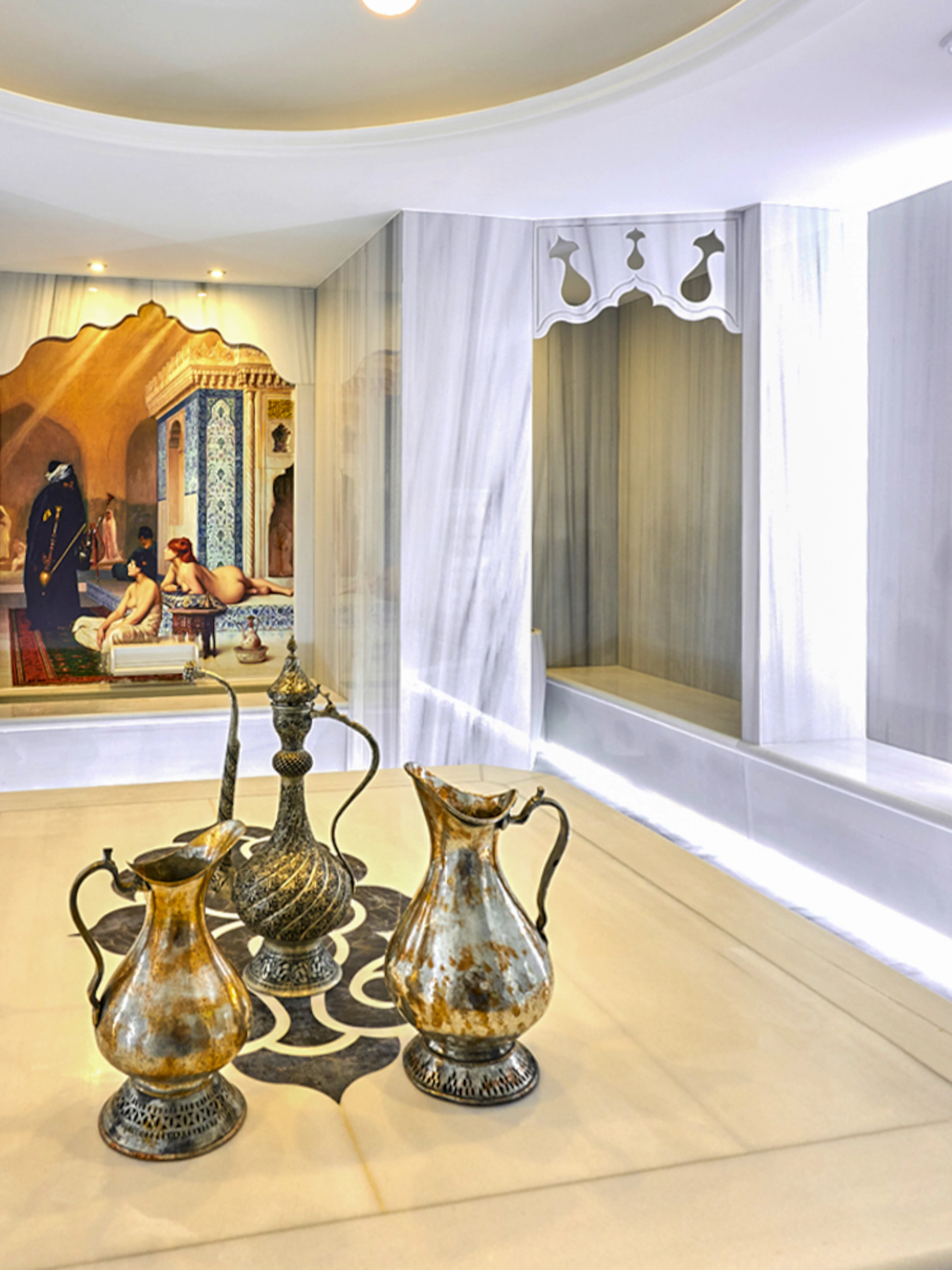 Turkish bath interior with ornate ewers and marble basin in Sisli, Istanbul.