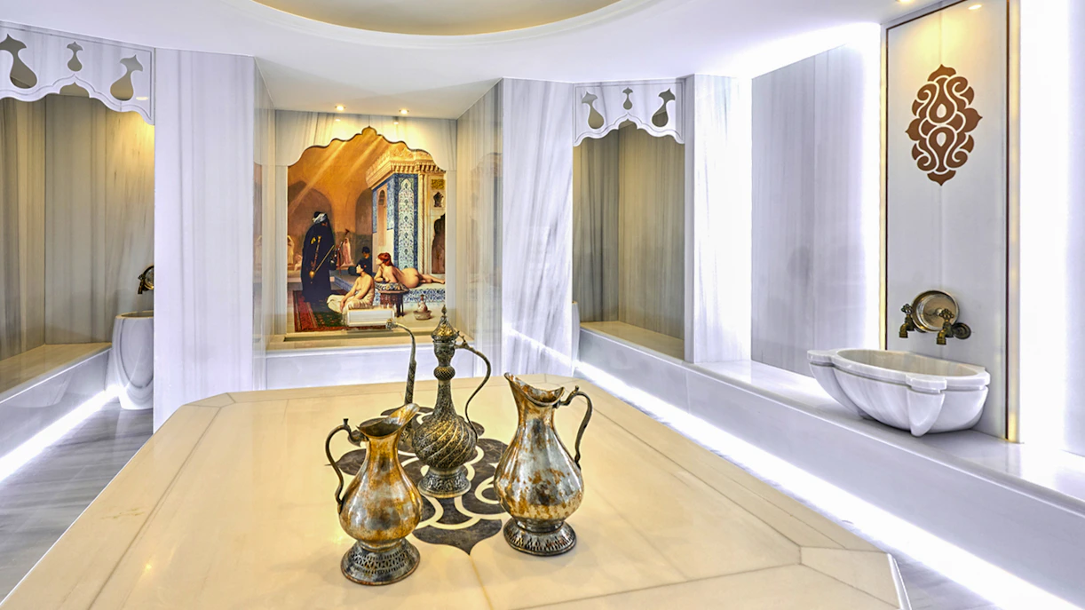 Turkish bath interior with ornate ewers and marble basin in Sisli, Istanbul.