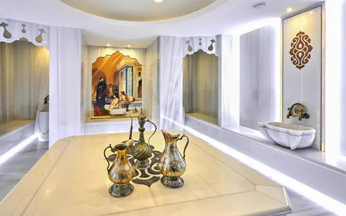 Turkish bath interior with ornate ewers and marble basin in Sisli, Istanbul.