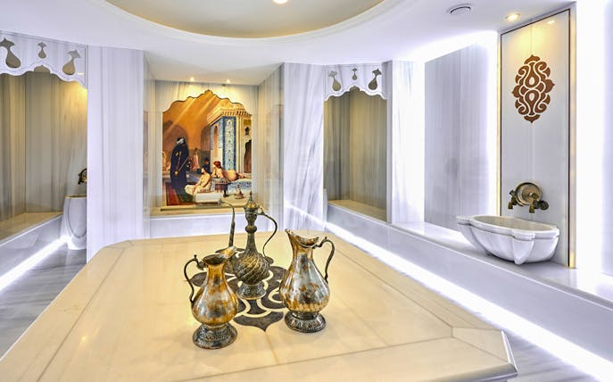 Turkish bath interior with ornate ewers and marble basin in Sisli, Istanbul.