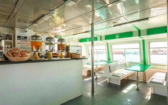 Inside view of dining area on Ibiza to Formentera cruise with breakfast setup.