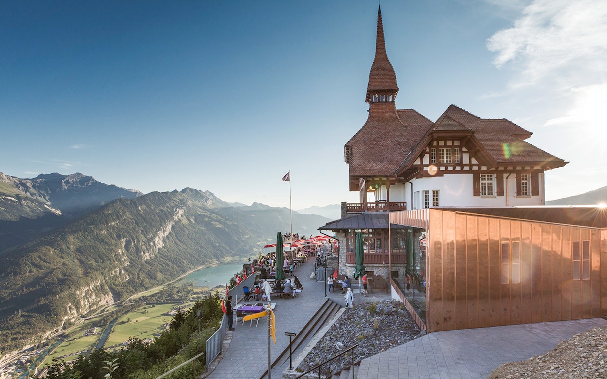 Funicular station at Harder Kulm with panoramic view of Swiss Alps and Lake Thun.