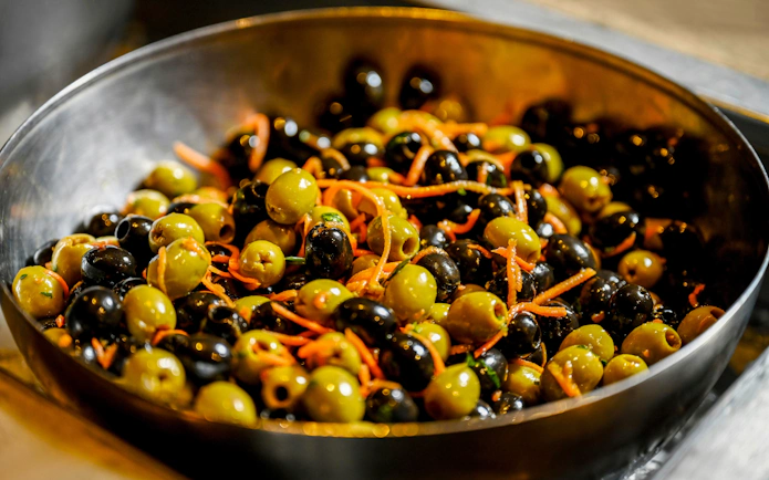 Olives and carrots served during desert safari meal.