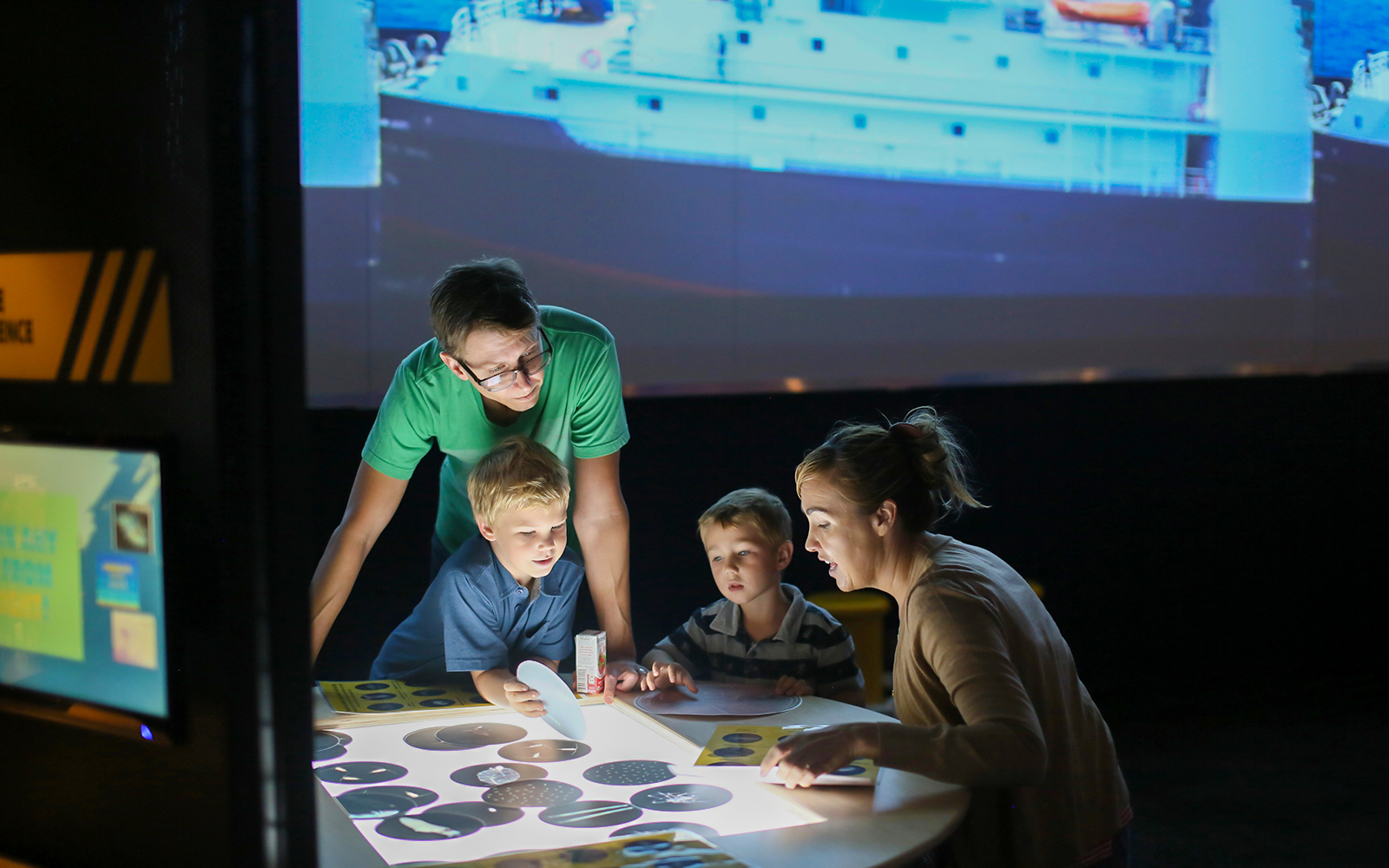 Children watching multimedia Film in USS Midway Museum