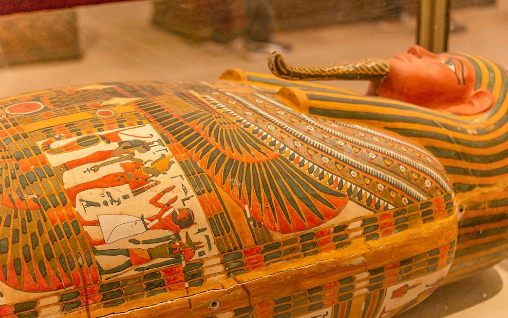 Sarcophagus with colorful hieroglyphics at the Egyptian Museum of Antiquities.