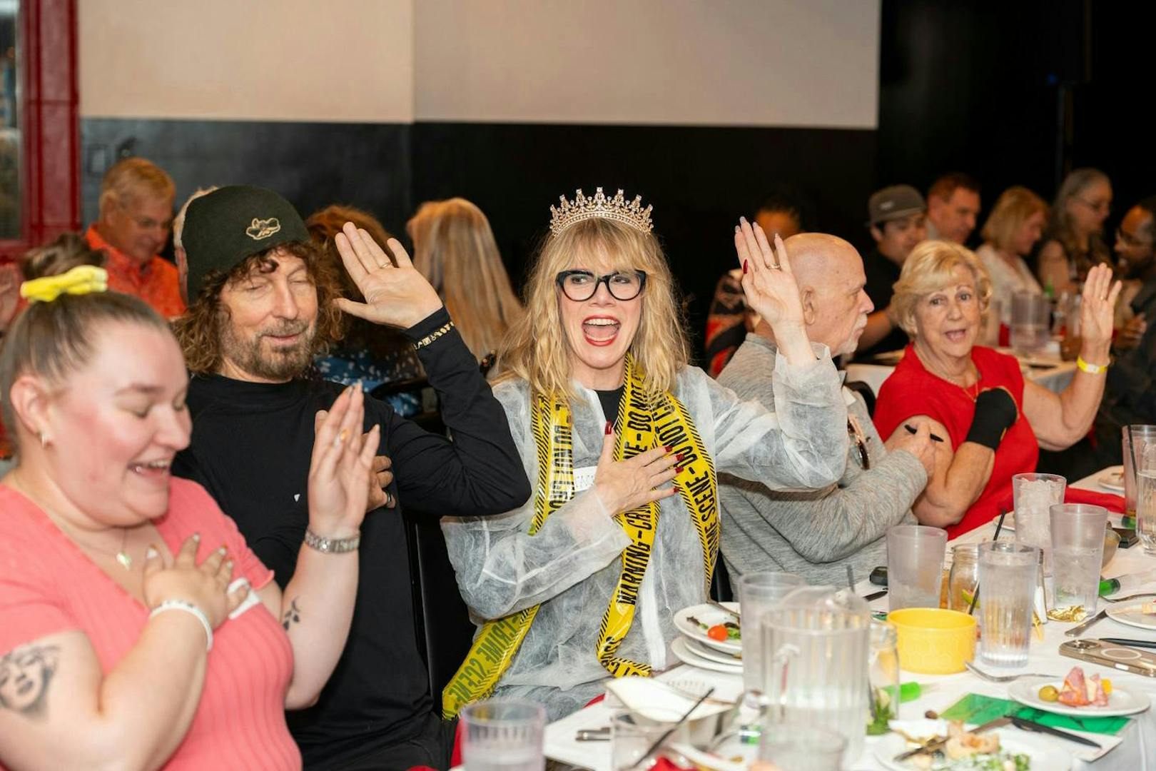 Guests enjoying interactive dinner show "Marriage Can Be Murder" in Las Vegas.