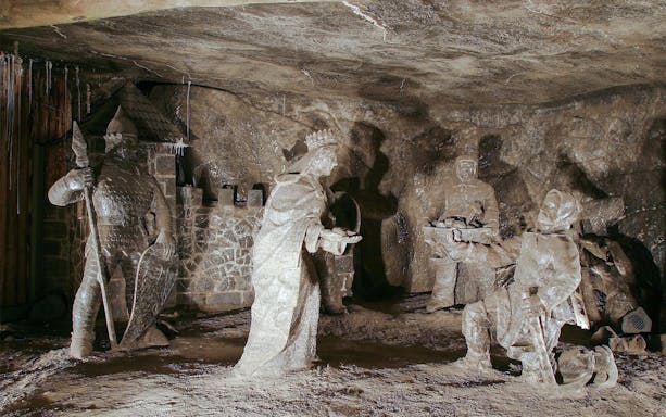 Salt sculptures depicting historical figures in Wieliczka Salt Mine, Poland.