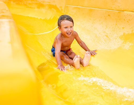 Visitors enjoying the Tubby Tunnel ride at ESCAPE Penang, Malaysia.
