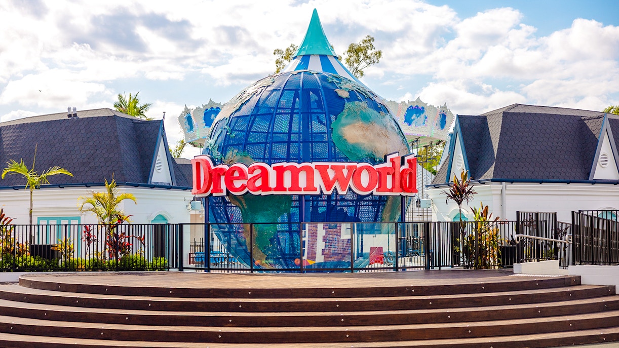 Dreamworld entrance with iconic globe sculpture, Gold Coast, Australia.