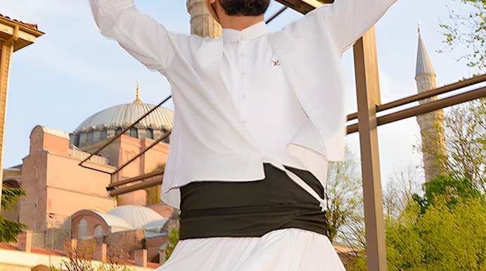 Whirling Dervish performing in front of a mosque in Istanbul.