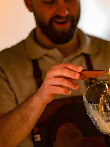 Bartender pouring Pilsner Urquell during Tapster training session.