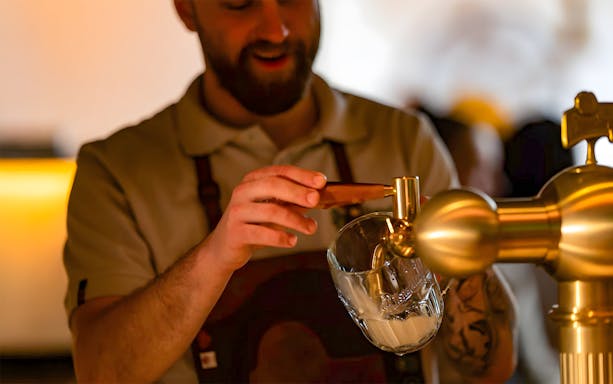 Bartender pouring Pilsner Urquell during Tapster training session.