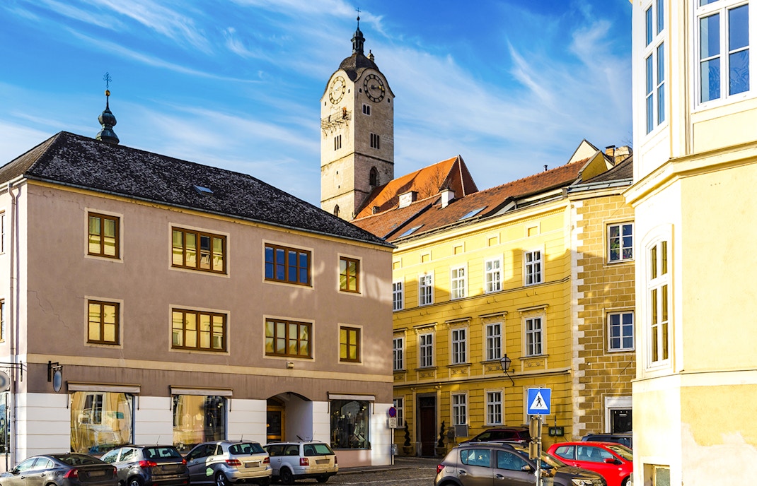 Clock tower and historic buildings in Krems an der Donau, Wachau Valley, Austria.