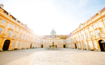 Melk Abbey courtyard with fountain, part of Hallstatt Highlights Day Trip from Vienna.