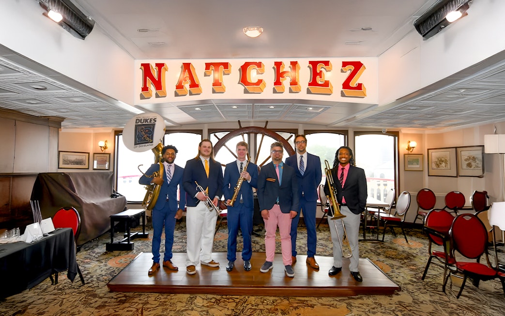 Dukes band members with instruments on Steamboat Natchez in New Orleans.