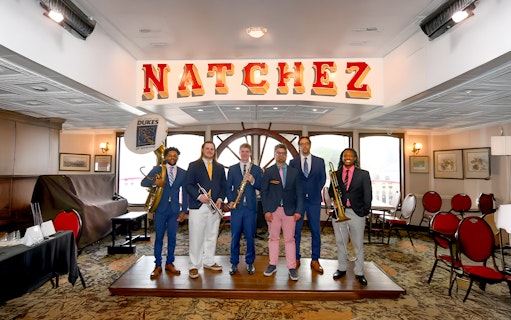 Dukes band members with instruments on Steamboat Natchez in New Orleans.