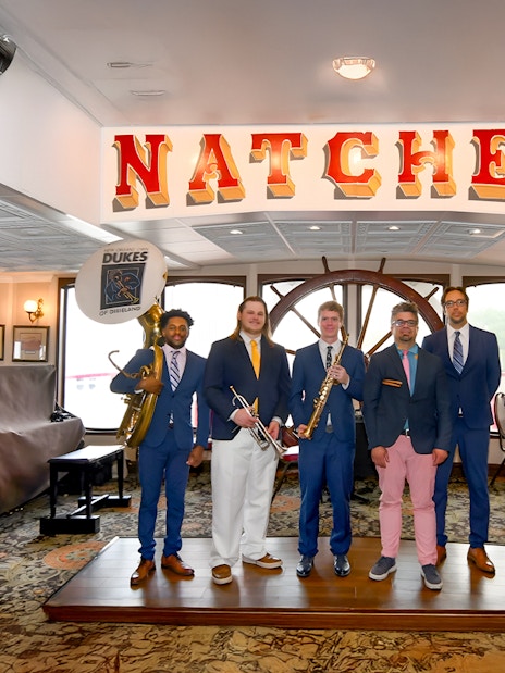 Dukes band members with instruments on Steamboat Natchez in New Orleans.