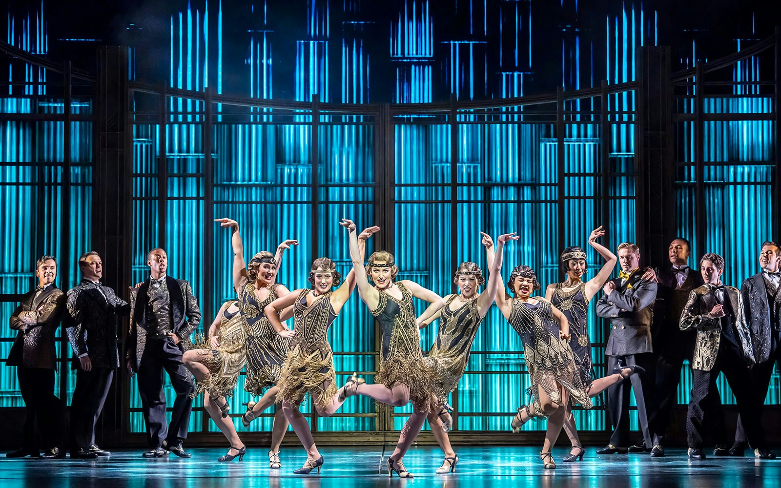 Actors performing The Great Gatsby Musical on stage with 1920s costumes in New York City.