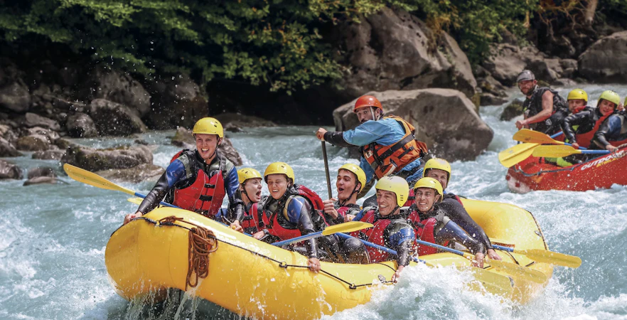 River rafting group navigating rapids in Interlaken.