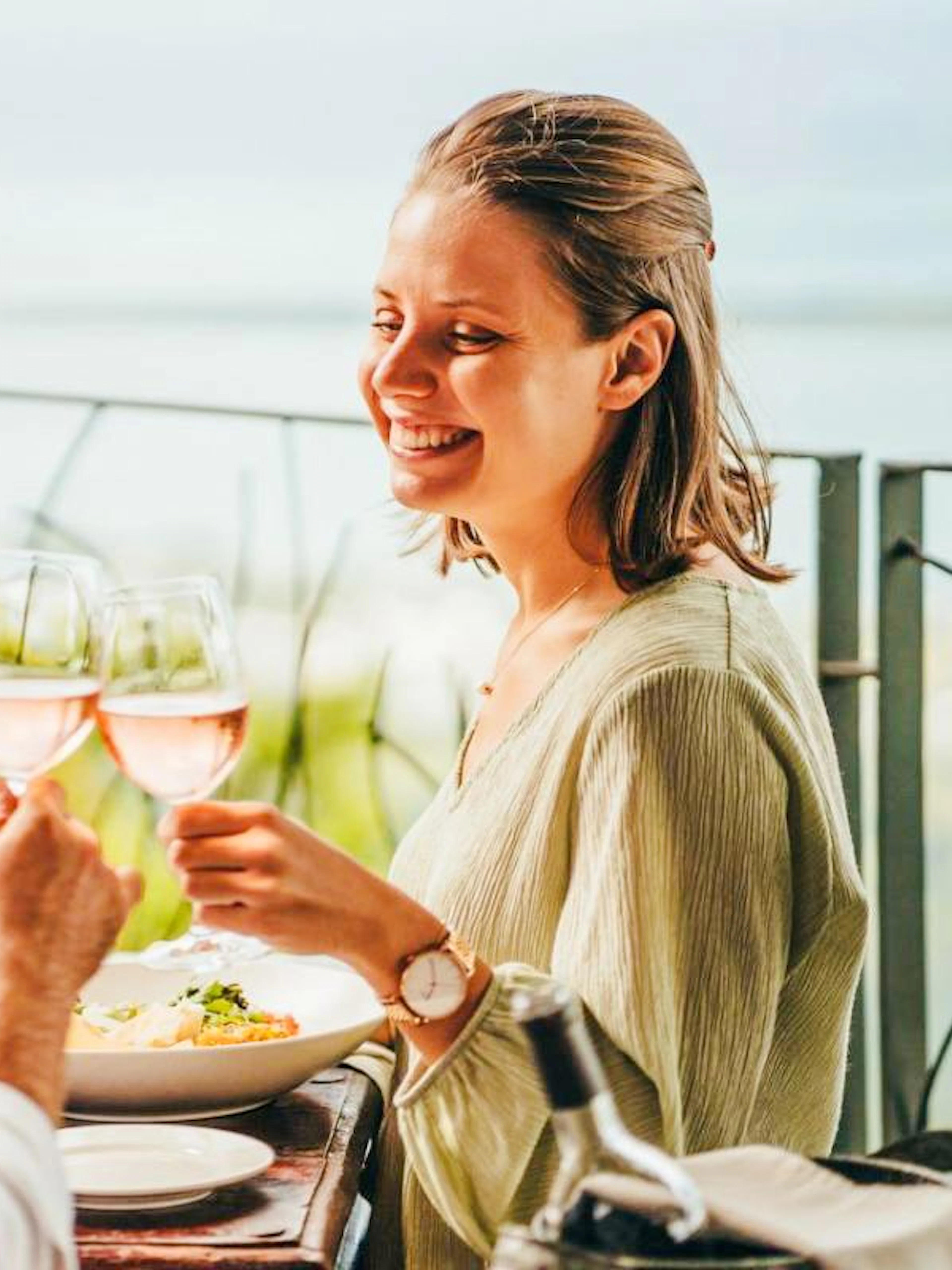Couple enjoying lunch with wine at Coloured Earth, Chamarel, Mauritius.