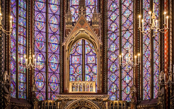 Stained glass windows in Sainte-Chapelle, Paris, showcasing intricate medieval designs.